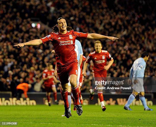Andy Carroll of Liverpool celebrates after scoring the first goal during the Barclays Premier League game between Liverpool and Manchester City at...