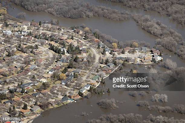 Levee made from sandbags holds back water from the Red River on April 11, 2011 in Fargo, North Dakota. Although the Red River crested in Fargo on...