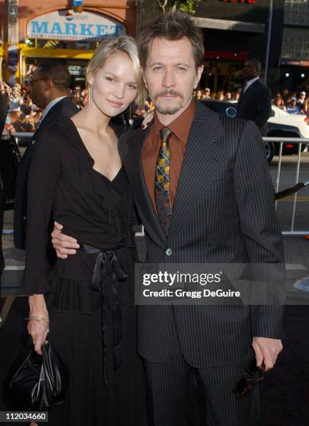 Alisa Marshall and Gary Oldman during "Batman Begins" Los Angeles Premiere - Arrivals at Chinese Theatre in Los Angeles, California, United States.