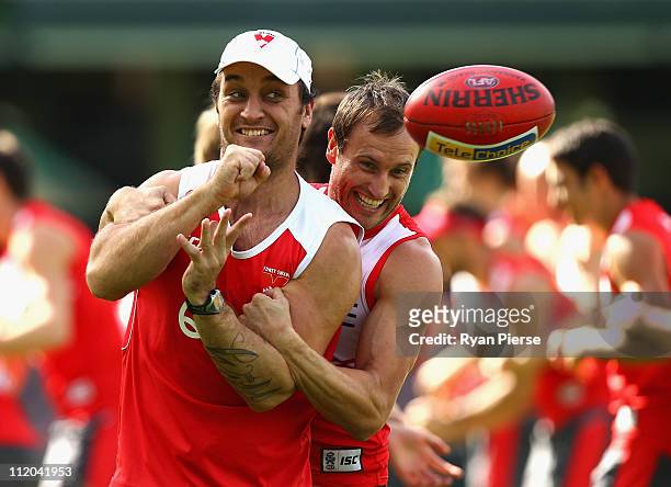 Daniel Bradshaw and Jude Bolton of the Swans train during a Sydney Swans AFL training session at Sydney Cricket Ground on April 12, 2011 in Sydney,...