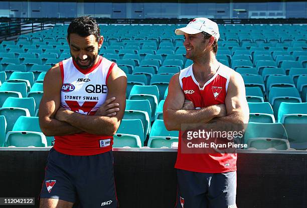 Adam Goodes and Daniel Bradshaw of the Swans chat before a Sydney Swans AFL training session at Sydney Cricket Ground on April 12, 2011 in Sydney,...
