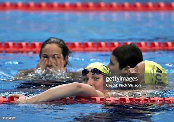 The Australian Womens 4x200m relay team of Elka Graham, Linda MacKenzie, Petria Thomas and Giaan Rooney jump into the pool after Australia finished...