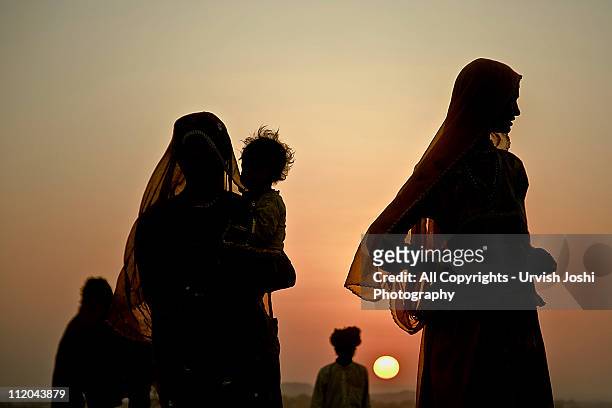 son and sun - rajasthani women stock pictures, royalty-free photos & images