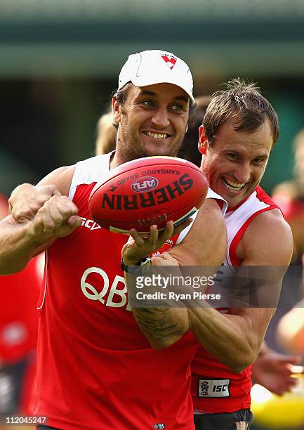 Daniel Bradshaw and Jude Bolton of the Swans train during a Sydney Swans AFL training session at Sydney Cricket Ground on April 12, 2011 in Sydney,...
