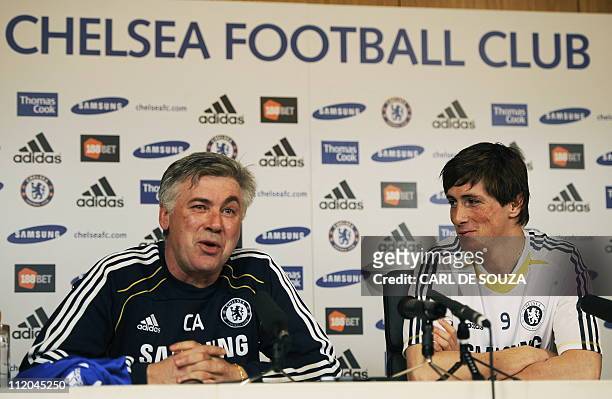 Chelsea's Italian Manager Carlo Ancelotti and Chelsea's new signing, Spanish striker Fernando Torres attend a press conference at Chelsea's training...