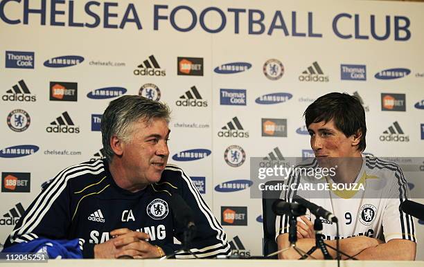 Chelsea's Italian Manager Carlo Ancelotti and Chelsea's new signing, Spanish striker Fernando Torres attend a press conference at Chelsea's training...