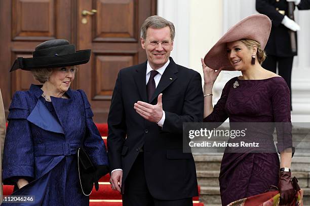 German President Christian Wulff greets Queen Beatrix and Princess Maxima of the Netherlands at Bellevue Presidential Palace on April 12, 2011 in...