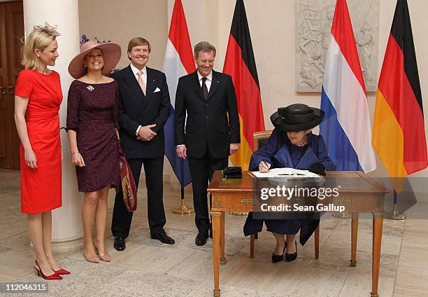 German President Christian Wulff and First Lady Bettina Wulff , Prince Willem-Alexander and Princess Maxima of the Netherlands look on as Queen...
