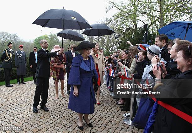 Queen Beatrix of the Netherlands greets school children at Bellevue Presidential Palace on April 12, 2011 in Berlin, Germany. The Dutch royals are on...