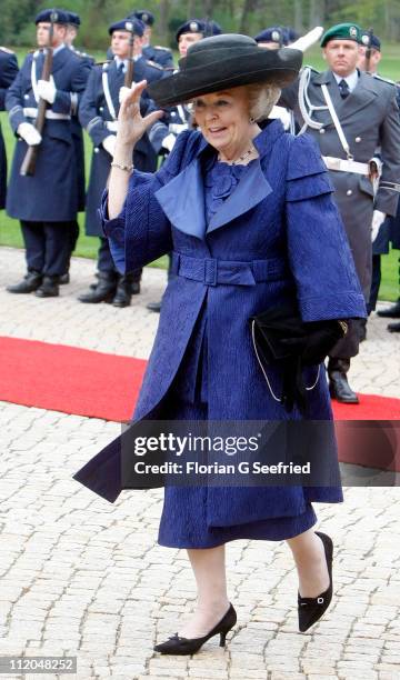 Queen Beatrix of the Netherlands walks past a guard of honor at Bellevue Presidential Palace on April 12, 2011 in Berlin, Germany. The Dutch royals...
