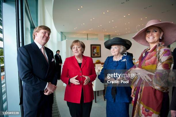 In this photo provided by the German Government Press Office, German Chancellor Angela Merkel welcomes Queen Beatrix , Prince Willem-Alexander and...
