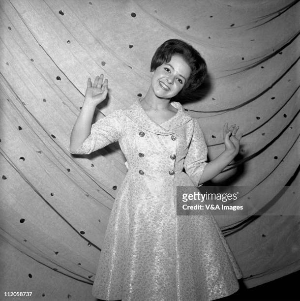 Brenda Lee, posed, backstage, 1960.