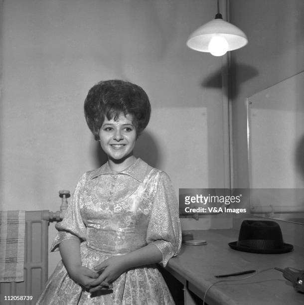 Brenda Lee, posed, backstage, in dressing room, 1960.