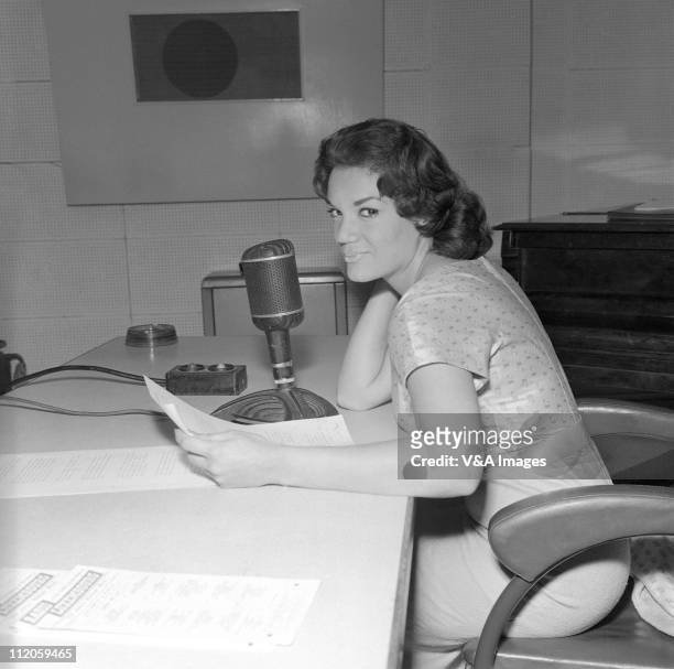 Connie Francis, posed, in radio studio, 1959.