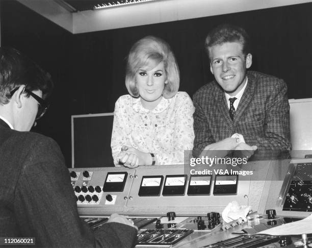 Dusty Springfield , leaning on a mixing desk at Philips Records Recording Studio, 1962.