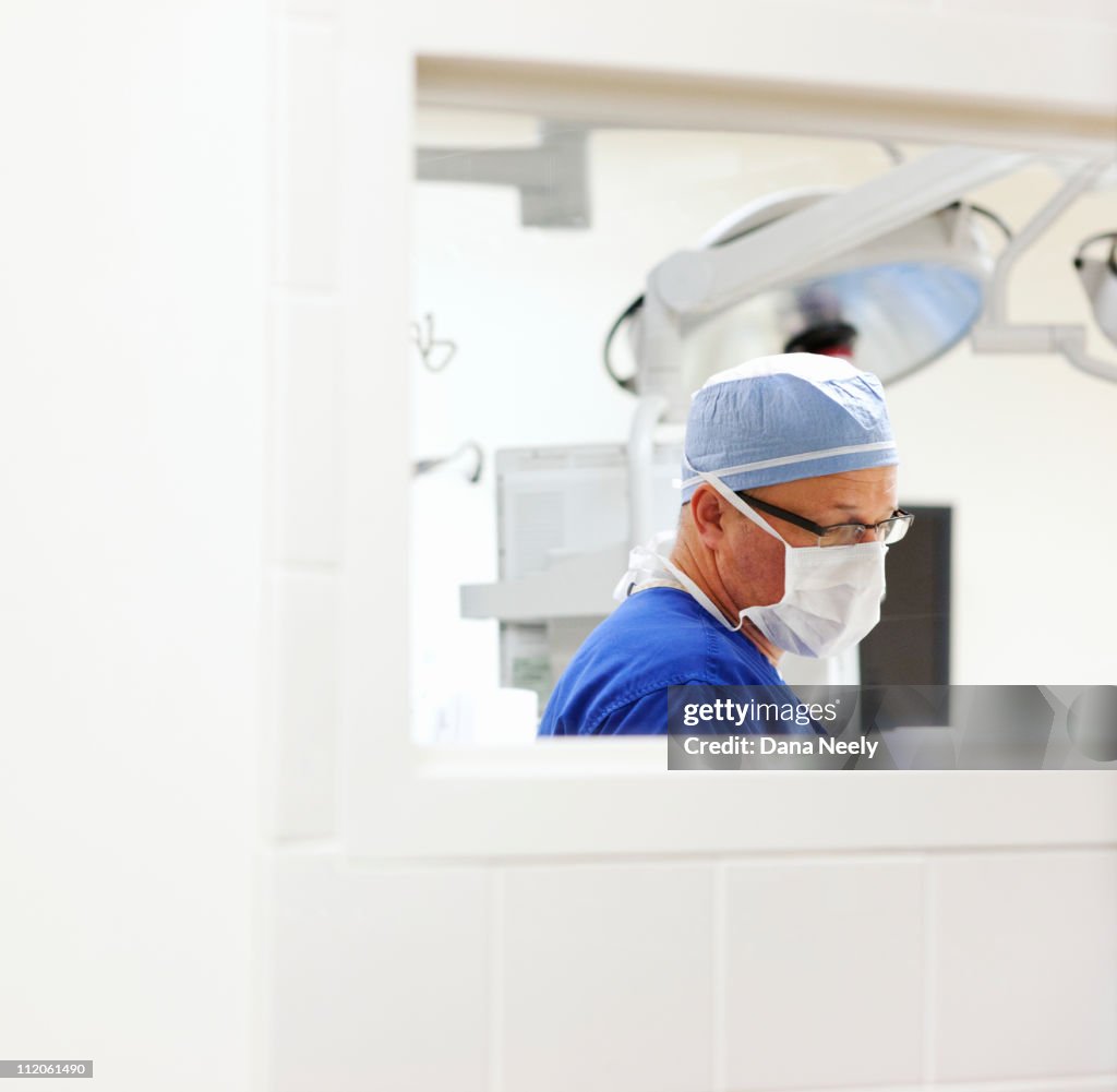 Surgeon in operating room.