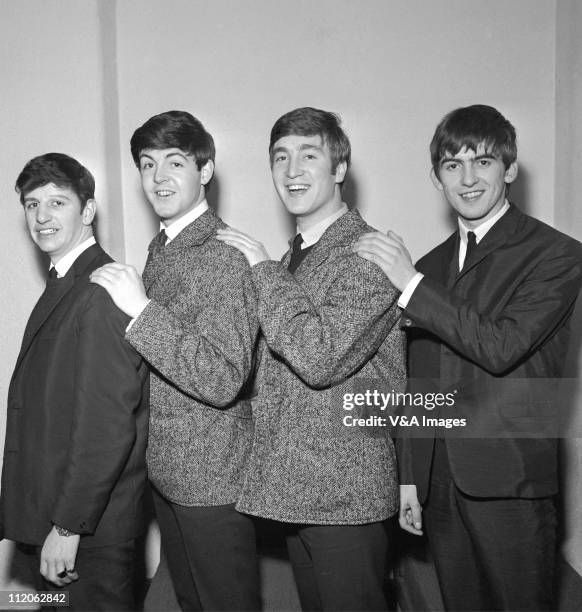 The Beatles, early group portrait, Ringo Starr, Paul McCartney, John Lennon, George Harrison - posed, backstage, circa 1962.