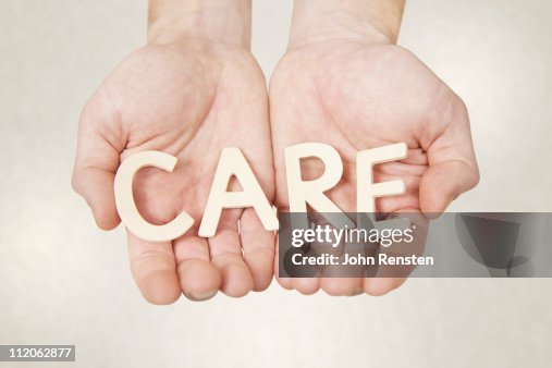 Hands holding letters spelling words Hands holding letters spelling words