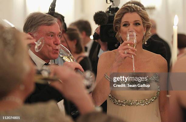 Former German President Horst Koehler and Princess Maxima of the Netherlands attend a state banquet given in honour of the visiting Dutch royals at...