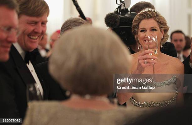 Prince Willem-Alexander and Princess Maxima of the Netherlands attend a state banquet given in honour of the visiting Dutch royals at Bellevue...