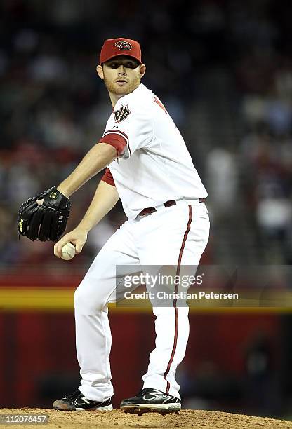 Starting pitcher Ian Kennedy of the Arizona Diamondbacks pitches against the Cincinnati Reds during the Major League Baseball home opening game at...