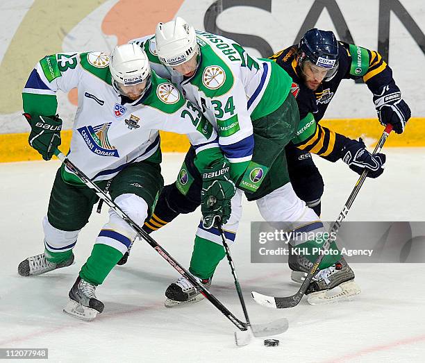 Miroslav Blatak of the Salavat Yulaev Ufa, Vitaly Proshkin of the Salavat Yulaev Ufa, Jan Marek of the Atlant Mytishchi are seen in action during the...