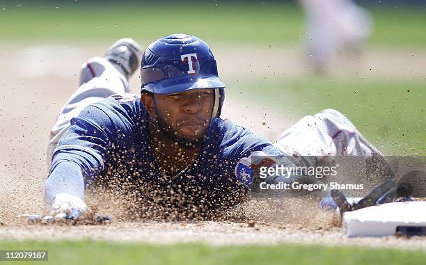 Elvis Andrus of the Texas Rangers steals third base in the sixth inning while playing the Detroit Tigers at Comerica Park on April 12, 2011 in...