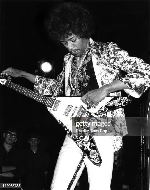 Rock guitarist Jimi Hendrix of the rock band 'The Jimi Hendrix Experience' performs onstage with a Gibson Flying V electric guitar at the Fifth...