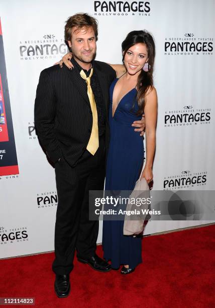 Actors Jame Mulligan and Juliana Hansen arrive at the opening night of 'Rain- A Tribute To The Beatles' at the Pantages Theatre on April 12, 2011 in...