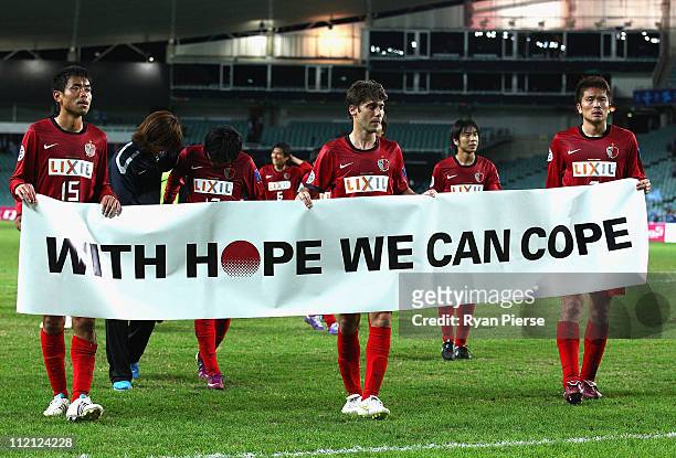 Kashima players thank their fans after the group H AFC Champions League match between Sydney FC and the Kashima Antlers at Sydney Football Stadium on...