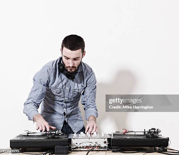 male dj playing music - disc jockey stock pictures, royalty-free photos & images