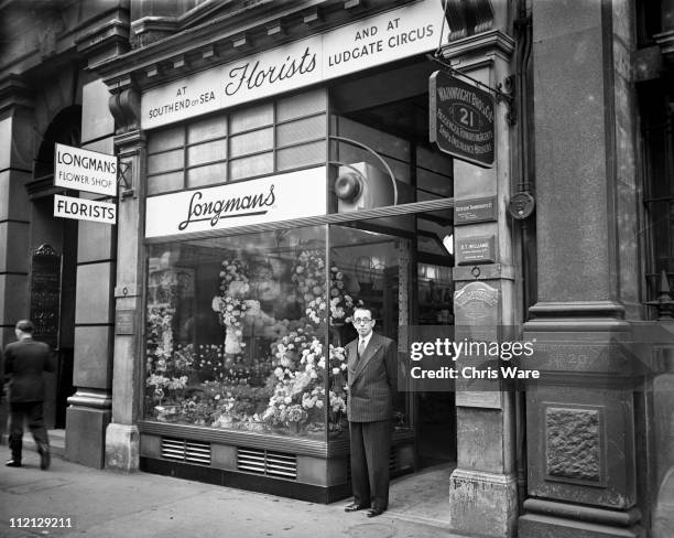 Florist Martin Longman, who has been appointed to make Princess Elizabeth's bouquet for her wedding to Prince Philip, outside his shop in fenchurch...