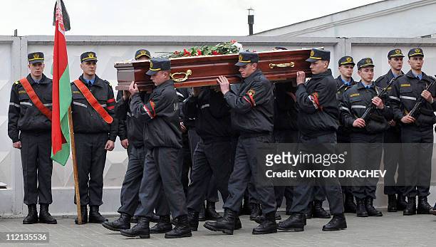 Belarussian policemen carry the coffin of Galina Pikulik, a victim of the Minsk metro bombing that killed 12 and wounded 200 on April 11, during a...