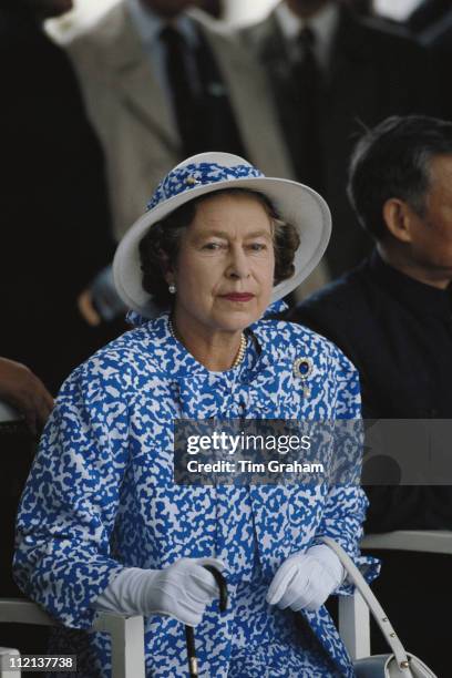 Queen Elizabeth II in Canton, during an official State Visit to China, October 1986. The Queen is wearing a blue and white dress with matching hat.
