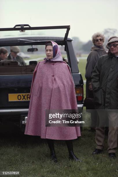 Queen Elizabeth II, wearing a pink cape, at the Royal Windsor Horse Show, held at Home Park in Windsor, Berkshire, England, Great Britain, May 1979.