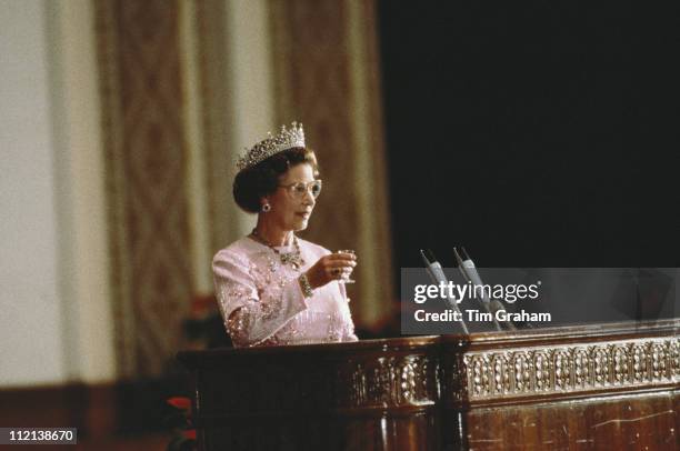 Queen Elizabeth II attending a banquet, held in the Hall Of The People, Beijing, whille on an official state visit to China, 13 October 1986. The...