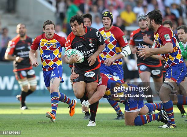 George Smith of Toulon breaks clear during the Heineken Cup quarter final between Perpignan and Toulon at the Olympic Stadium on April 9, 2011 in...