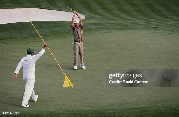 Sandy Lyle of Scotland holes out his winning putt on the 18th green during the final round of the U.S Masters Golf Tournament on 10th April 1988 at...