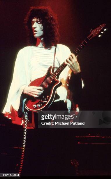 Brian May of Queen performs on stage, Rainbow Theatre, London, November 1974.