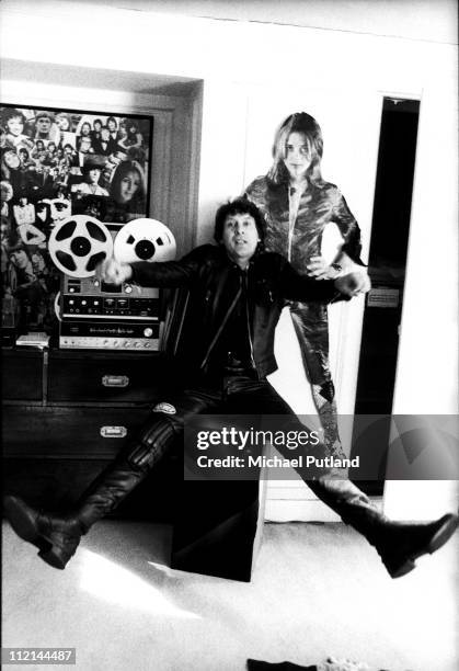 Portrait of record producer Mickie Most at his RAK Records headquarters, London, 27th February 1975, with a cardboard cutout of RAK artist Suzi...