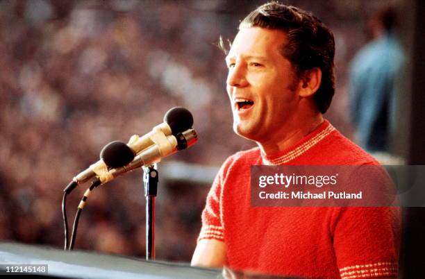 Jerry Lee Lewis performs on stage at the London Rock'n'Roll Show, Wembley, London, 5th August 1972.