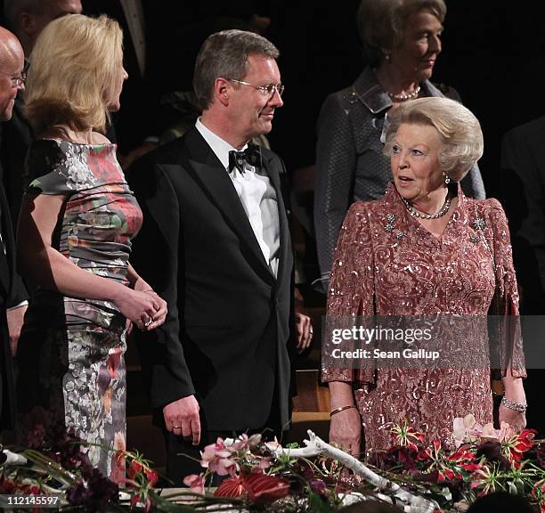 German First Lady Bettina Wulff, President Christian Wulff, and Queen Beatrix of the Netherlands attend a performance of the Dutch Royal Concert...