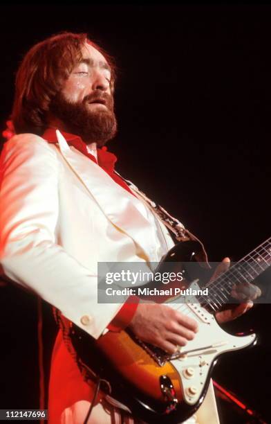 Dave Mason performs on stage, London, 1974.