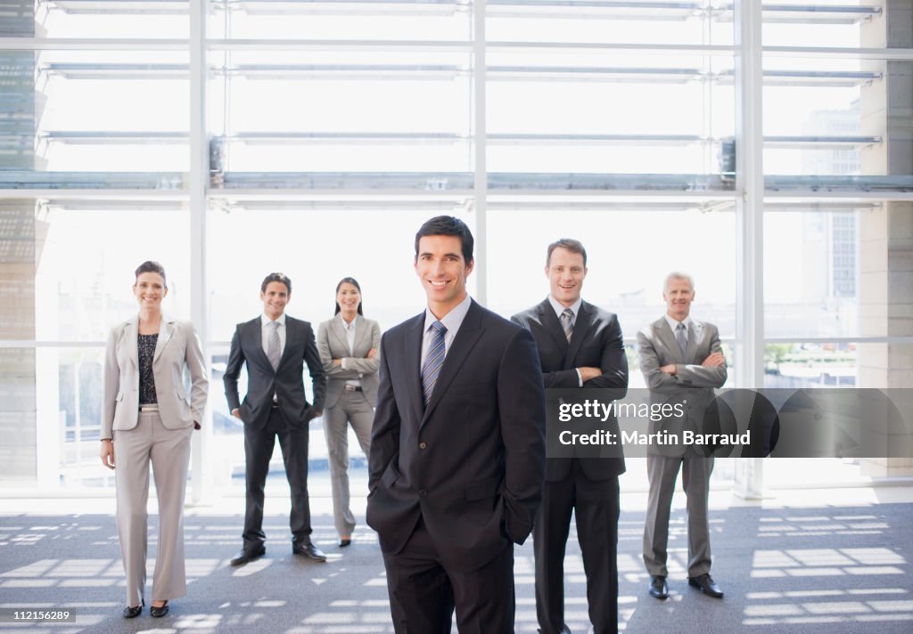 Business people standing together in office