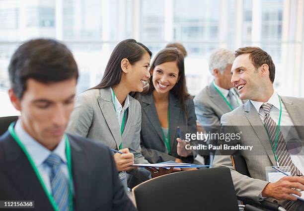 business people talking in seminar in office - secret sessions stock pictures, royalty-free photos & images