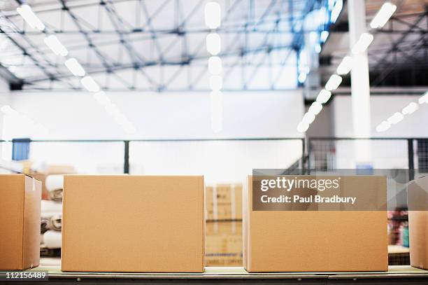 boxes in row in shipping area - distribution warehouse stockfoto's en -beelden