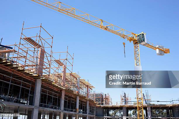 crane on construction site - construction cranes stockfoto's en -beelden