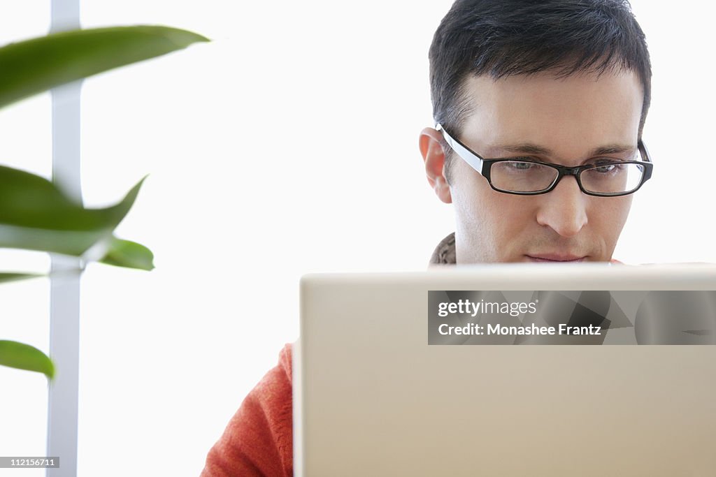 Business man working on laptop in office