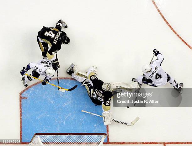 Marc-Andre Fleury of the Pittsburgh Penguins makes a save on Vincent Lecavalier of the Tampa Bay Lightning in Game One of the Eastern Conference...