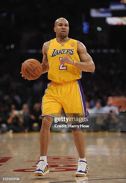Derek Fisher of the Los Angeles Lakers dribbles against the San Antonio Spurs at Staples Center on April 12, 2011 in Los Angeles, California. NOTE TO...